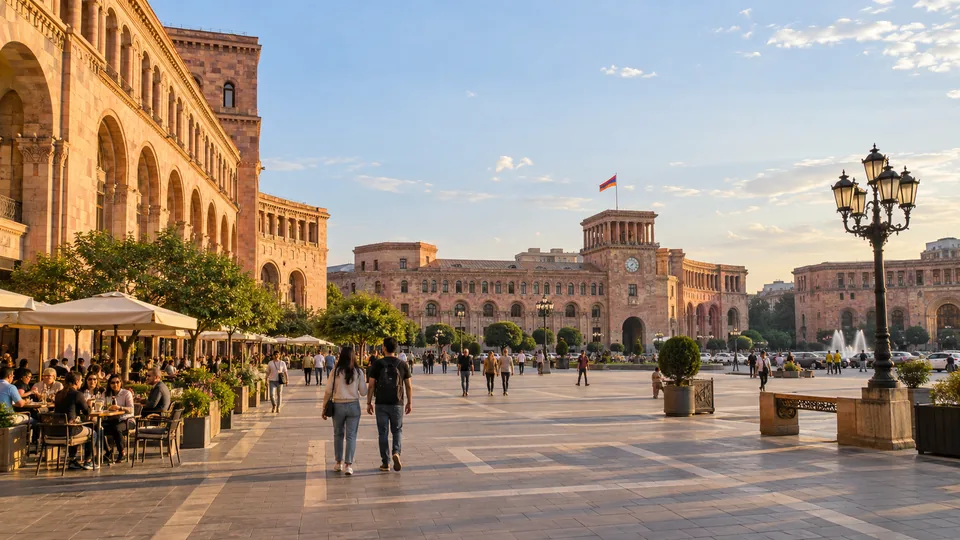 Pink tuff-stone buildings and pedestrians around Republic Square in Yerevan